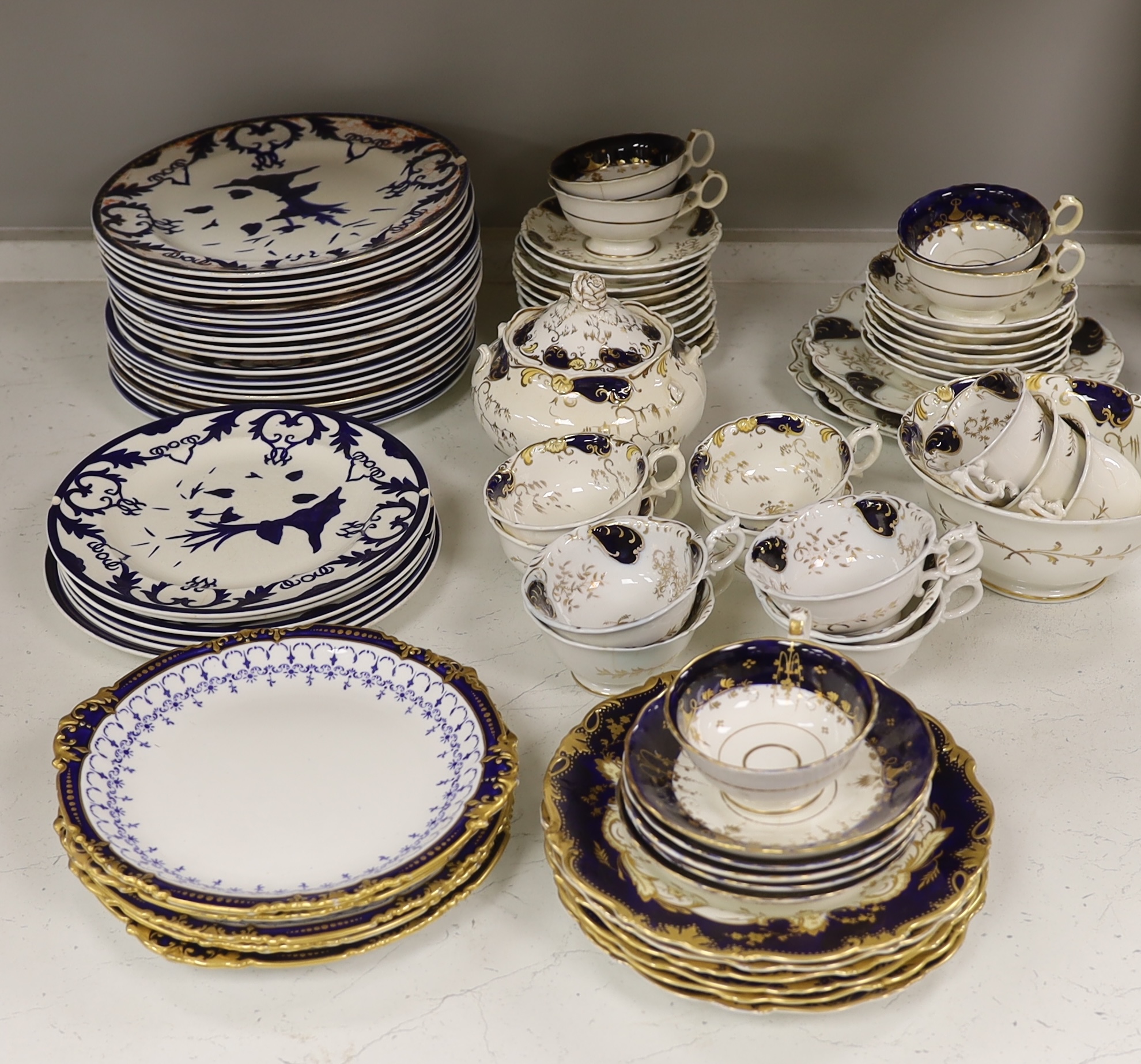 A Royal Crown Derby blue and gilt bordered part dessert service, together with a Victorian Staffordshire blue and gilt part tea service